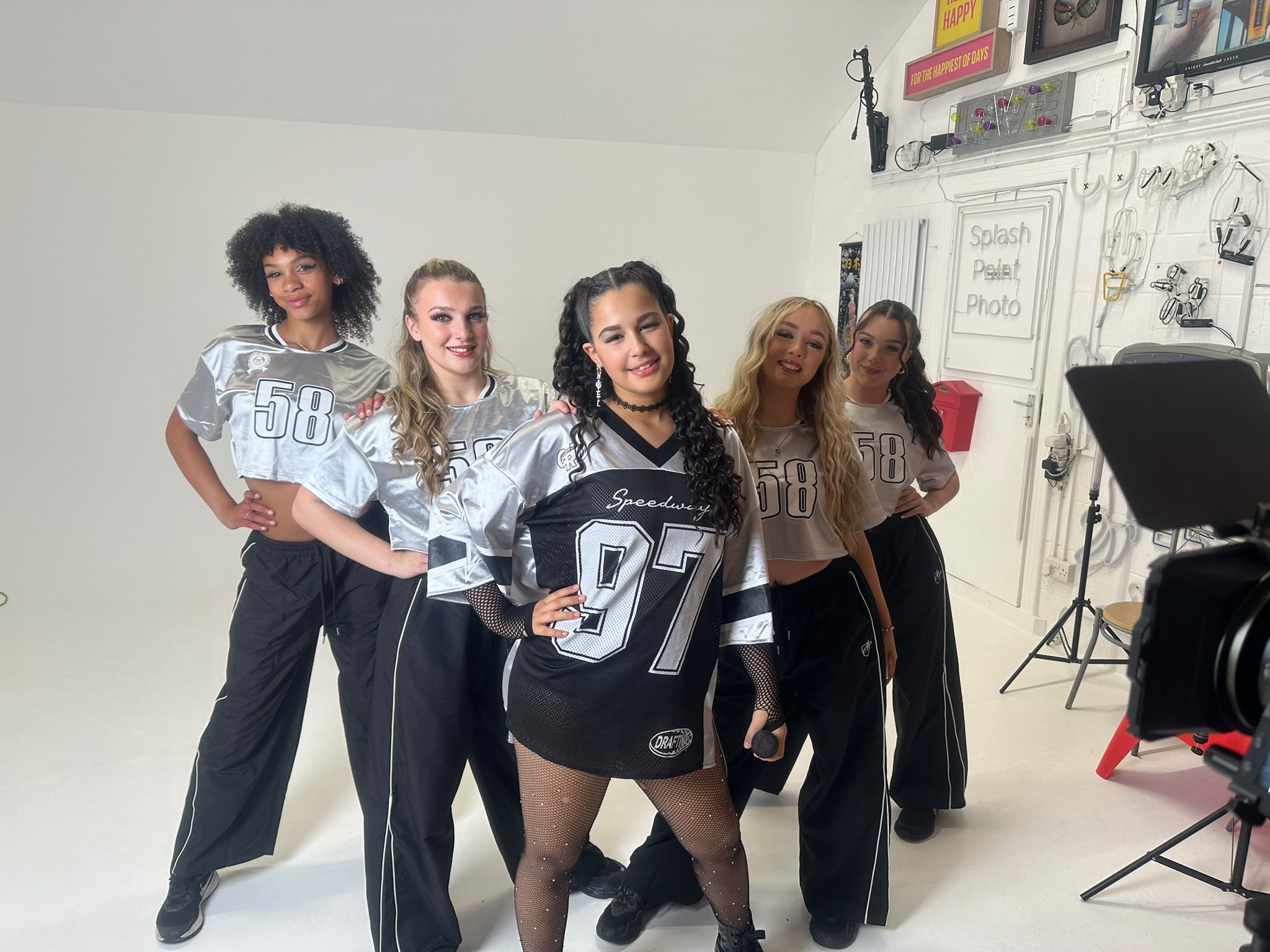 Ella-Grace with a dance crew in a studio